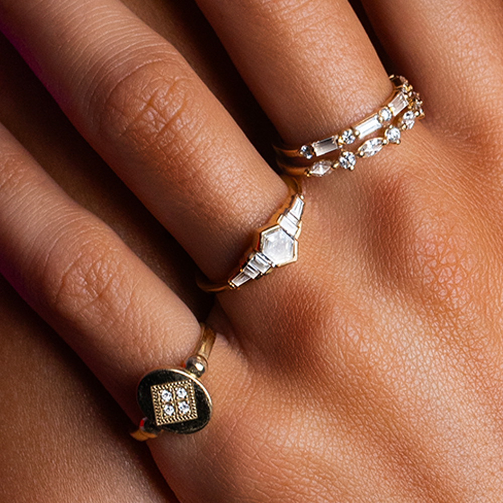 Oval stamp ring in white diamonds